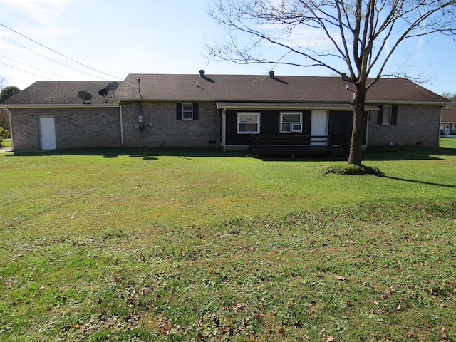 back of house with a lawn