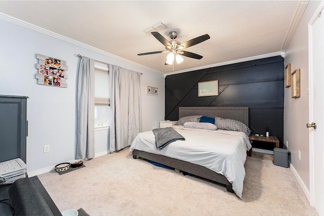 carpeted bedroom featuring ceiling fan and crown molding