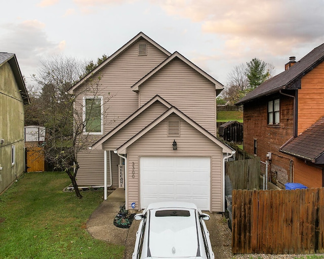 view of front facade with a lawn and a garage