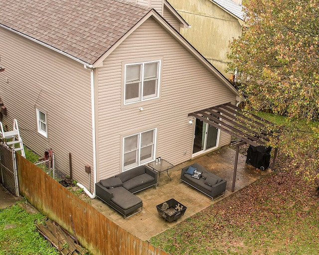 back of property with an outdoor hangout area and a patio area