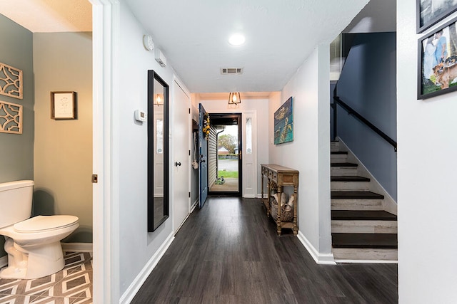 hall featuring dark wood-type flooring