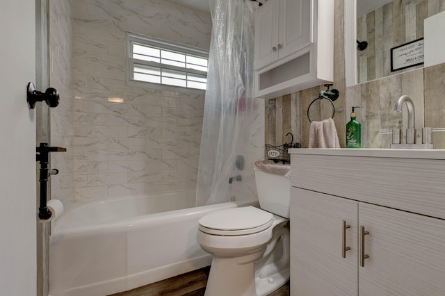 bathroom featuring toilet, wood-type flooring, and shower / tub combo with curtain