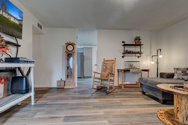 living room with light hardwood / wood-style flooring