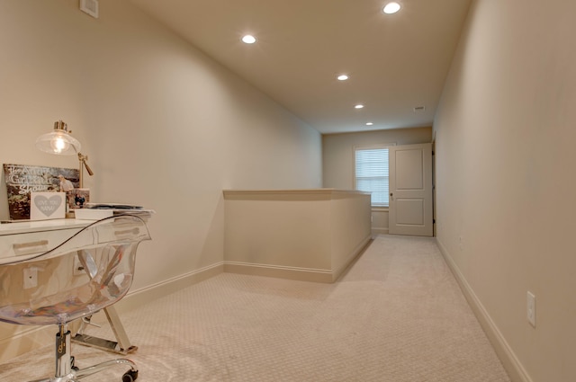 corridor with light colored carpet