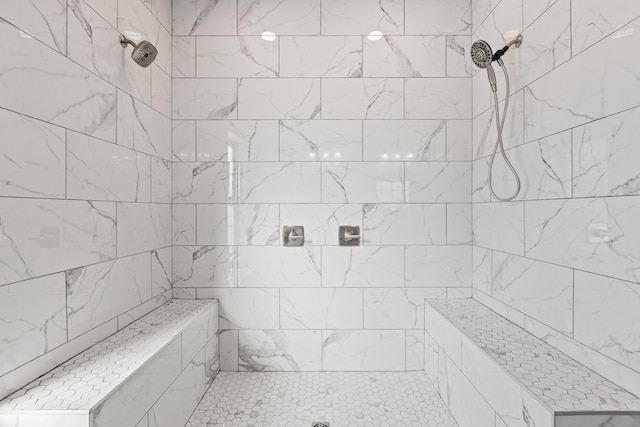 bathroom with a tile shower