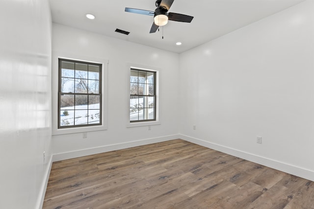 empty room featuring wood-type flooring and ceiling fan