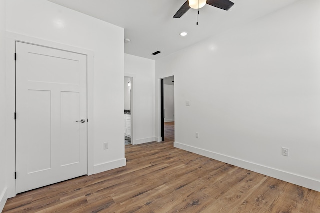 unfurnished bedroom with hardwood / wood-style floors and ceiling fan