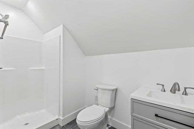 bathroom featuring vaulted ceiling, walk in shower, vanity, and toilet