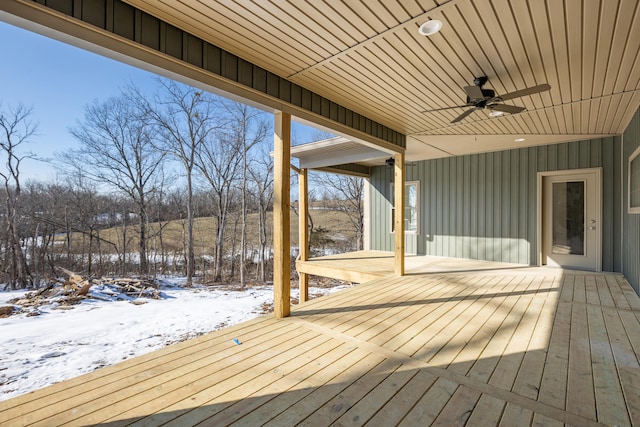 snow covered deck featuring ceiling fan