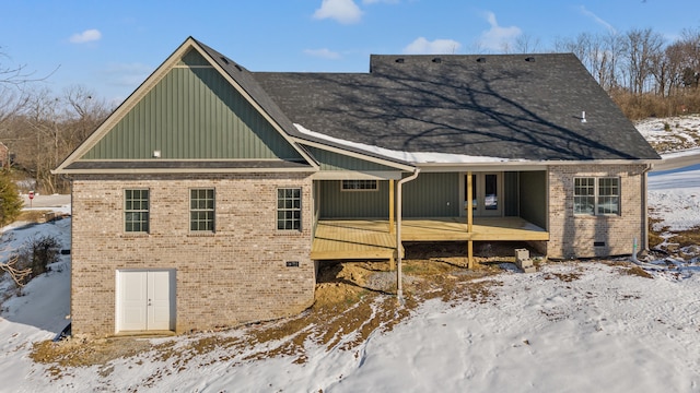 view of snow covered house