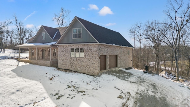 exterior space featuring a porch and a garage