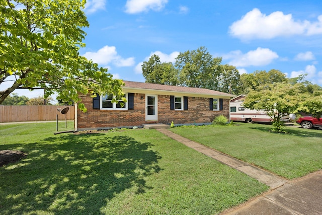 single story home featuring a front yard