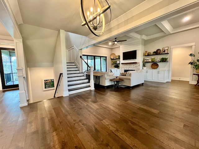 unfurnished living room featuring ceiling fan with notable chandelier, beamed ceiling, dark hardwood / wood-style flooring, and coffered ceiling