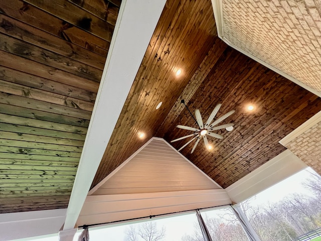 interior details featuring ceiling fan and wooden walls