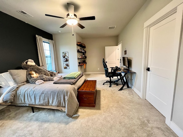 bedroom with light colored carpet and ceiling fan