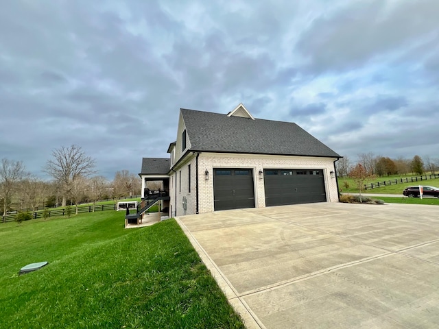 view of side of property featuring a yard