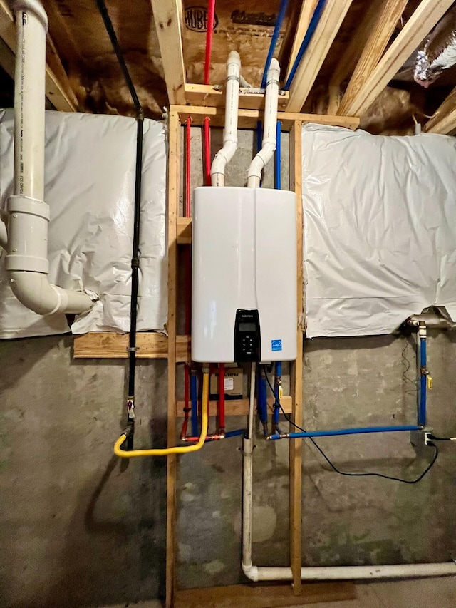 utility room featuring water heater