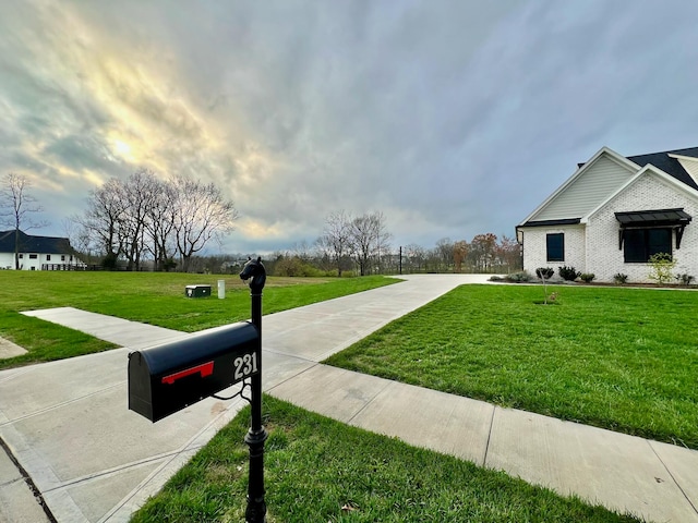 view of property's community with a lawn