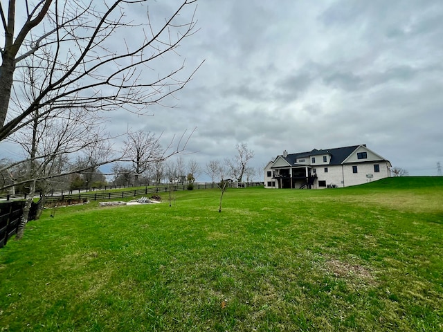 view of yard with a rural view