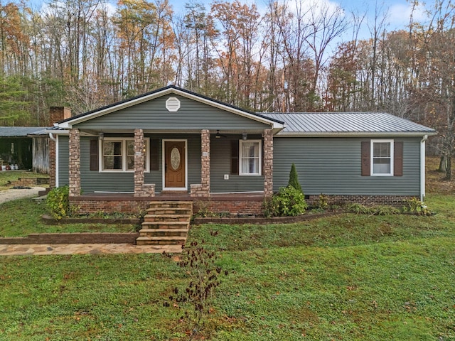 single story home featuring a porch and a front yard