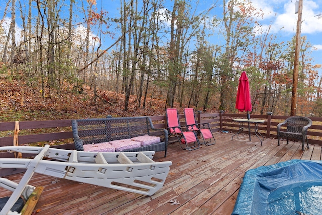 wooden deck featuring outdoor lounge area