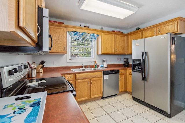 kitchen featuring sink, light tile patterned floors, and appliances with stainless steel finishes