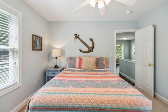 carpeted bedroom featuring ceiling fan