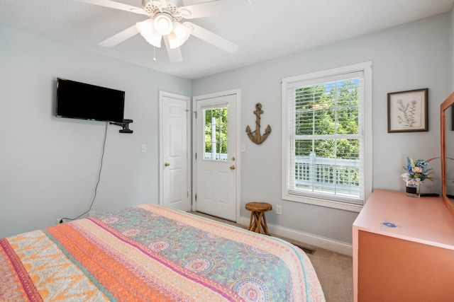 bedroom with ceiling fan and carpet floors