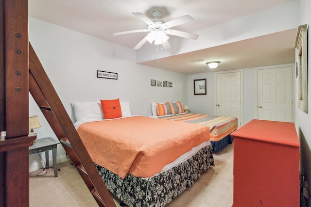 carpeted bedroom with ceiling fan