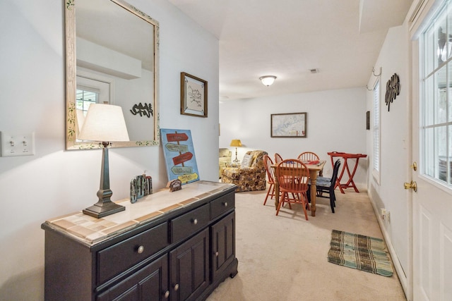 interior space featuring light colored carpet