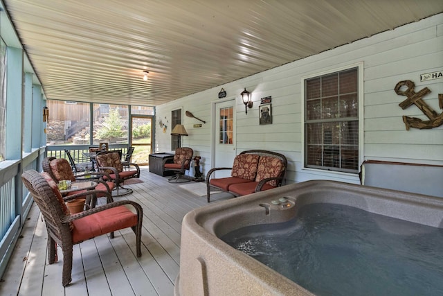 sunroom with a jacuzzi