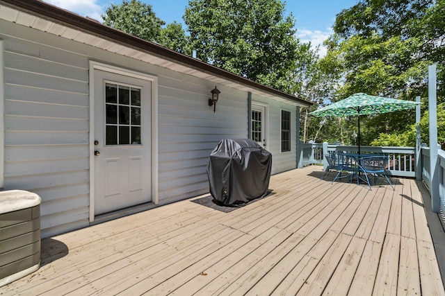 wooden deck with grilling area