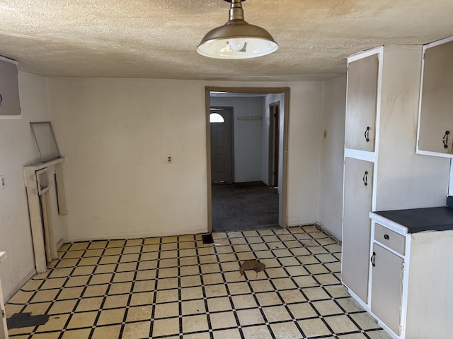 kitchen featuring a textured ceiling