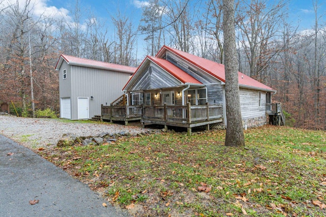 view of front of house with a garage and a wooden deck