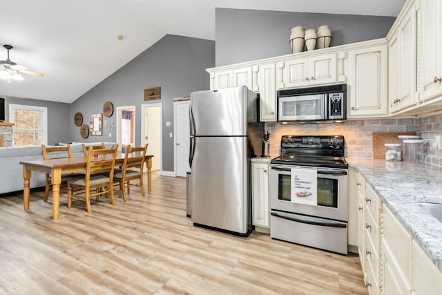 kitchen with decorative backsplash, appliances with stainless steel finishes, light hardwood / wood-style floors, and ceiling fan