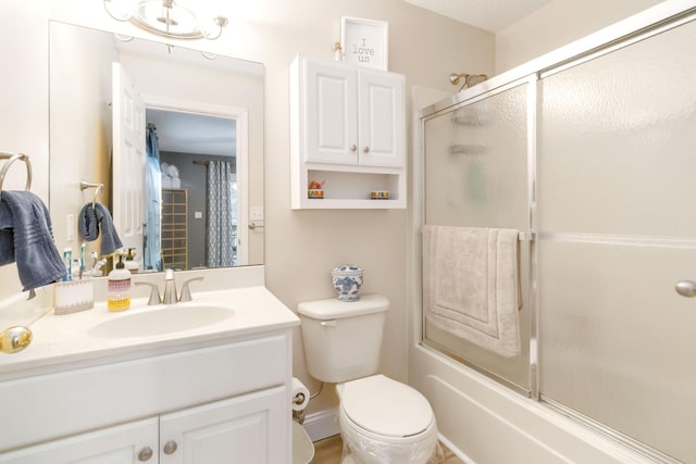 full bathroom featuring vanity, toilet, and enclosed tub / shower combo