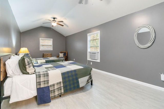 bedroom featuring cooling unit, light hardwood / wood-style flooring, ceiling fan, and lofted ceiling