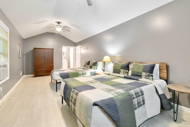 bedroom featuring ceiling fan, light hardwood / wood-style flooring, and lofted ceiling