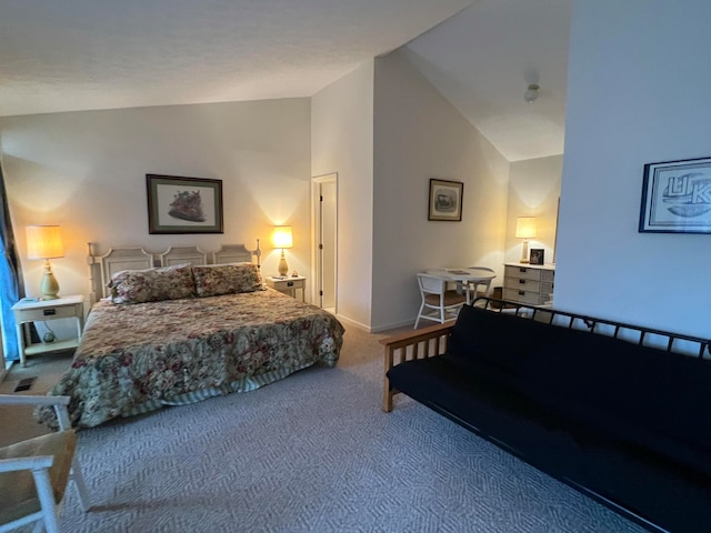 carpeted bedroom featuring high vaulted ceiling