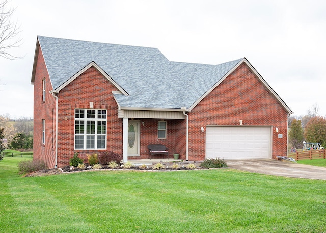 view of front of house with a front yard and a garage