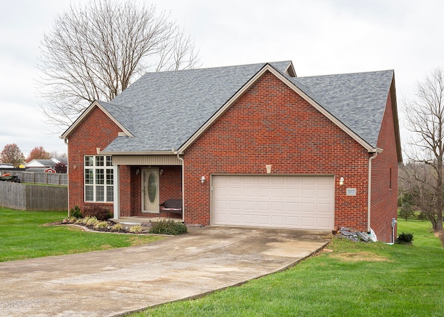 view of front of property with a garage and a front yard