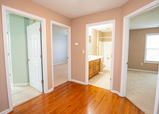 hall with light wood-type flooring