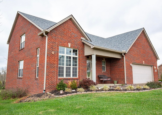 view of front of house with a front lawn and a garage