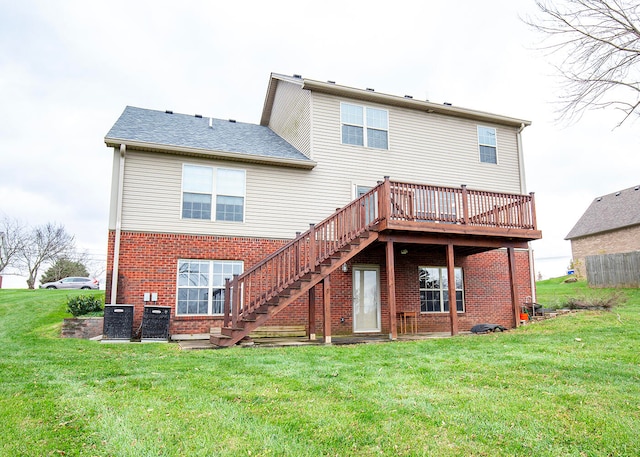 back of house featuring a deck and a yard