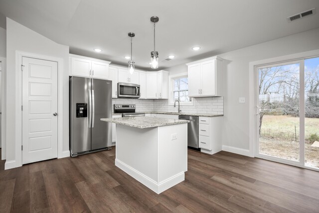 unfurnished dining area featuring an inviting chandelier and dark wood-type flooring