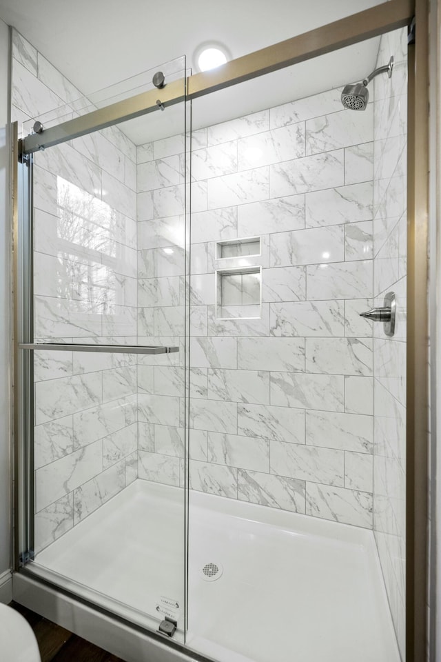 bathroom featuring a shower stall