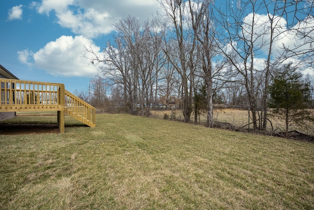 view of yard with stairway and a wooden deck