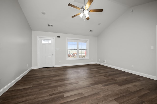 foyer entrance with ceiling fan, vaulted ceiling, and dark hardwood / wood-style floors