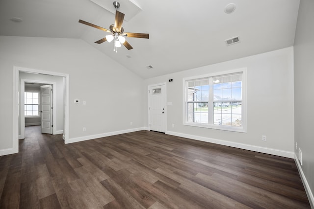 unfurnished living room featuring dark hardwood / wood-style flooring, ceiling fan, and vaulted ceiling