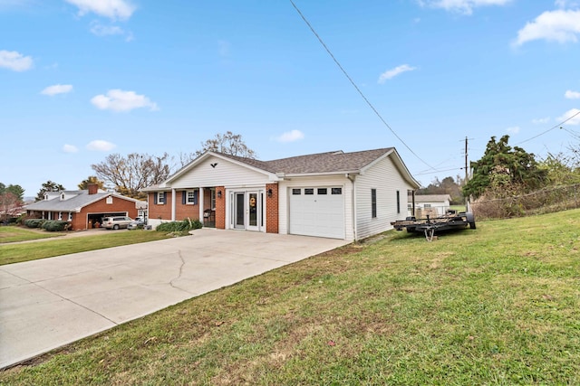 ranch-style home featuring french doors, a garage, and a front lawn